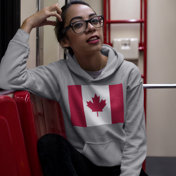 canada-flag-happy-hispanic-girl-wearing-a-pullover-hoodie-template-while-in-the-metro-a17650